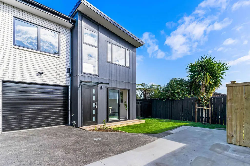 Stunning front-yard landscaping at a Bradbury Road property, featuring a manicured lawn, garden beds and pathway, designed by VOS