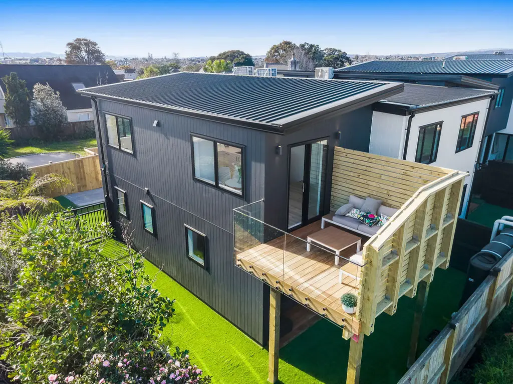 Stunning front-yard landscaping at a Bradbury Road property, featuring a manicured lawn, garden beds and pathway, designed by VOS