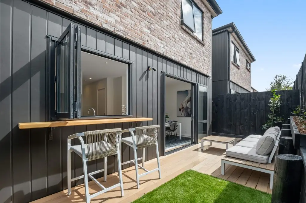 Spacious modern office interior with wooden flooring and minimalistic furniture